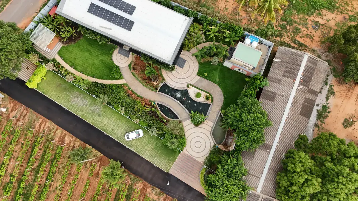 Aerial view of an integrated hardscape — driveways, pathways and courtyards in one paving language