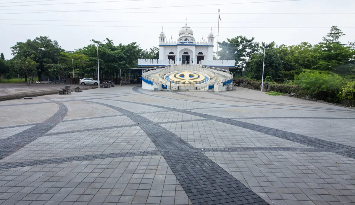 Large public plaza with consistent concrete paver colour and pattern across the full surface
