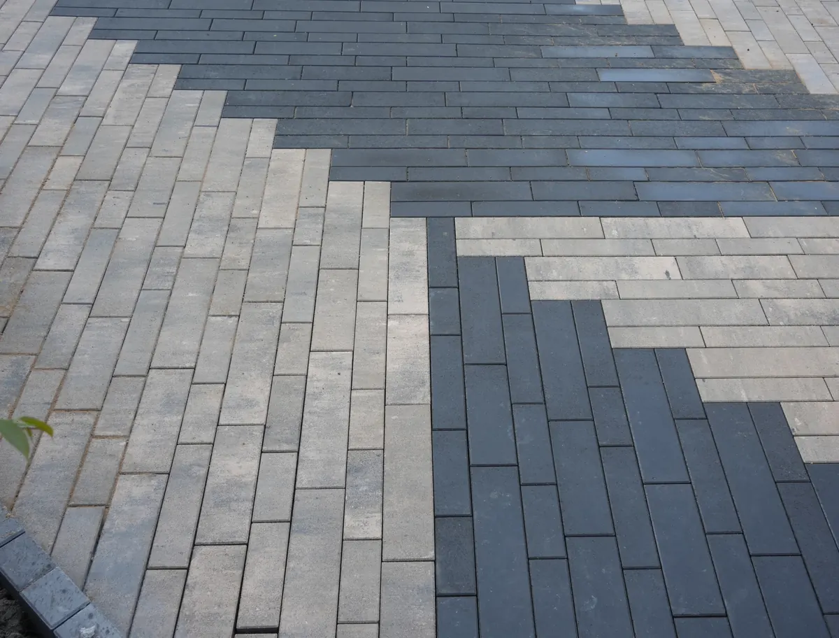 Close view of dense concrete plank pavers with tight, clean joints and unbroken edges