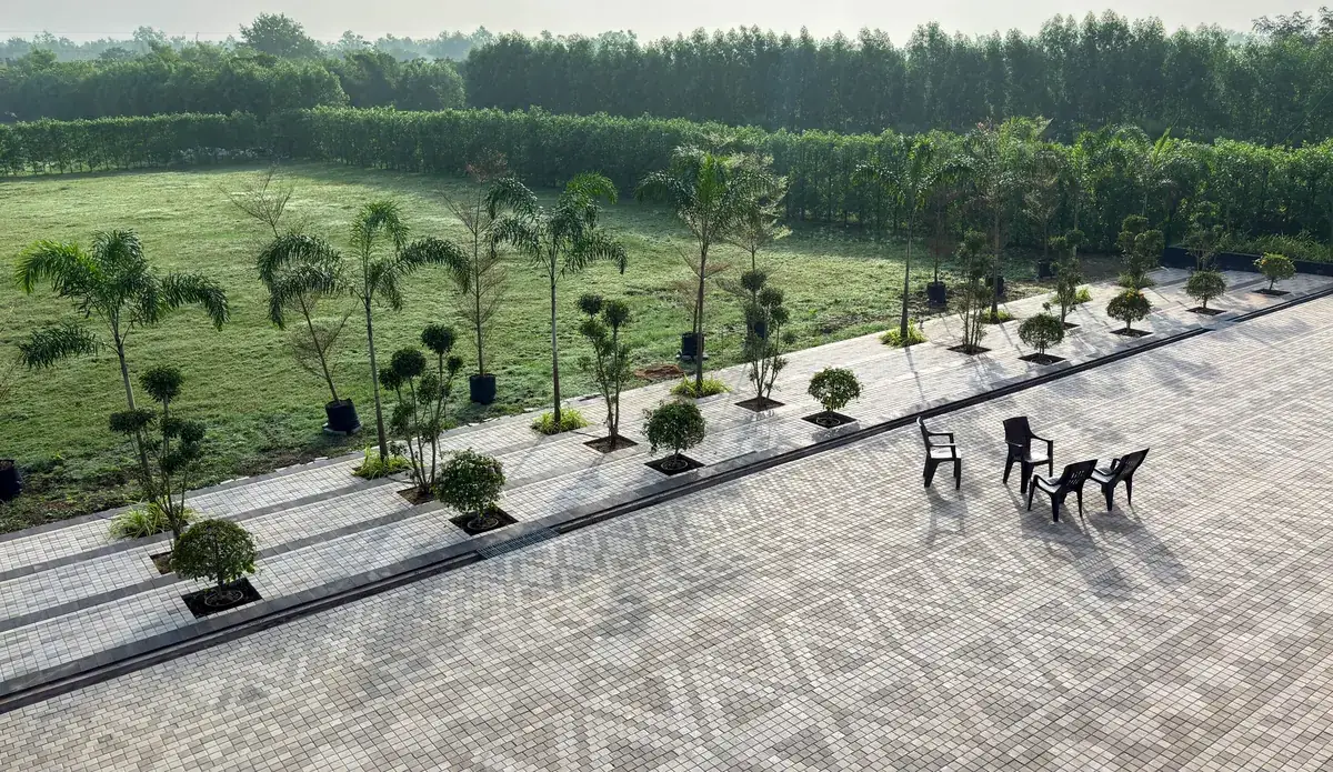 Wide paver plaza with landscaped lawns holding its colour and pattern years after handover